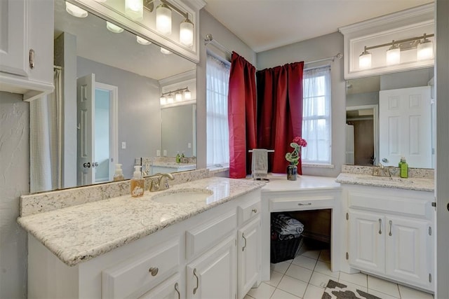 bathroom featuring tile patterned flooring and vanity