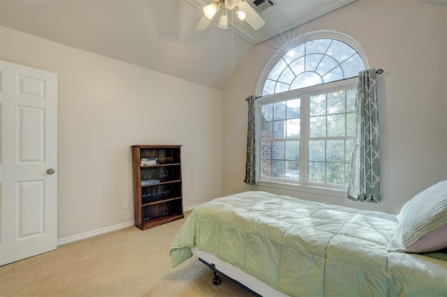 carpeted bedroom with ornamental molding, ceiling fan, and lofted ceiling