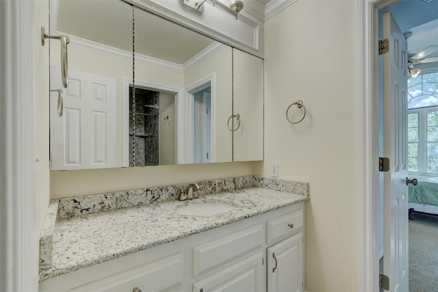 bathroom featuring vanity and ornamental molding