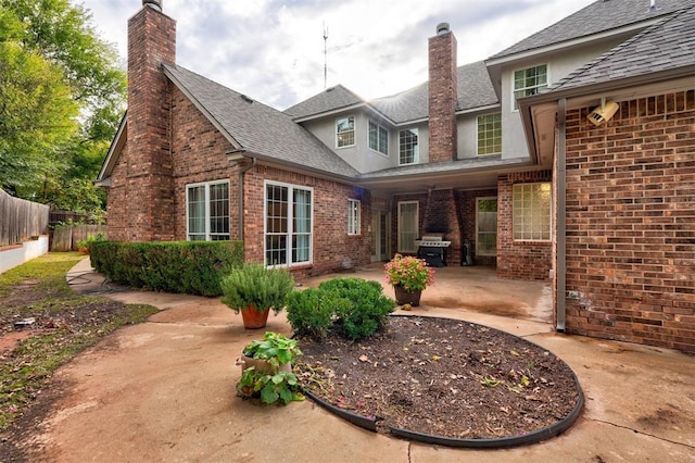 back of property featuring a patio area