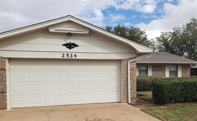 ranch-style house featuring a garage