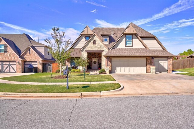 view of front of house featuring a garage and a front lawn