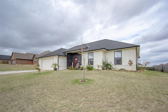 view of front of house with a front lawn and a garage