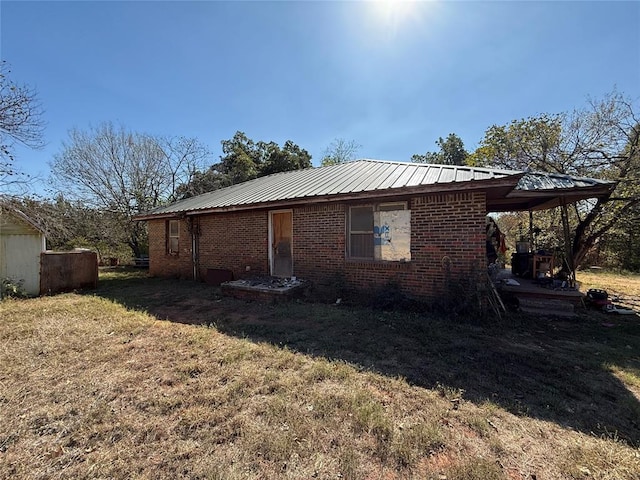 view of property exterior with a lawn