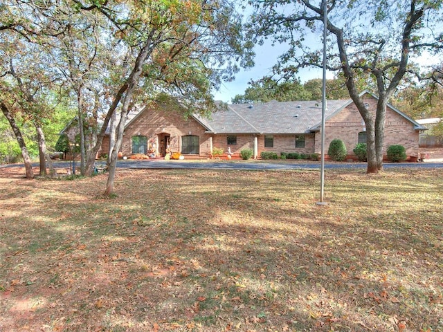 ranch-style house with a front lawn