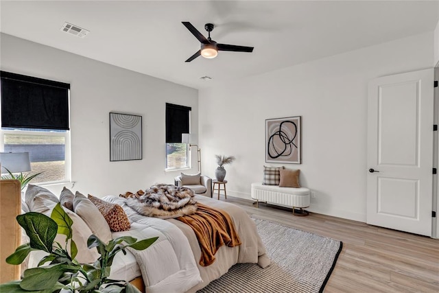 bedroom with light wood-type flooring and ceiling fan