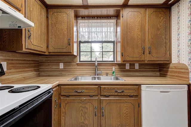 kitchen with decorative backsplash, sink, and white appliances