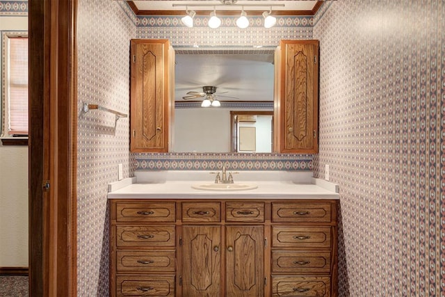 bathroom with vanity, crown molding, and ceiling fan