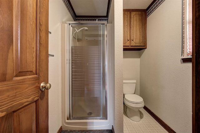 bathroom featuring crown molding, an enclosed shower, and toilet