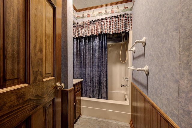 bathroom featuring tile patterned floors, shower / bath combination with curtain, and ornamental molding