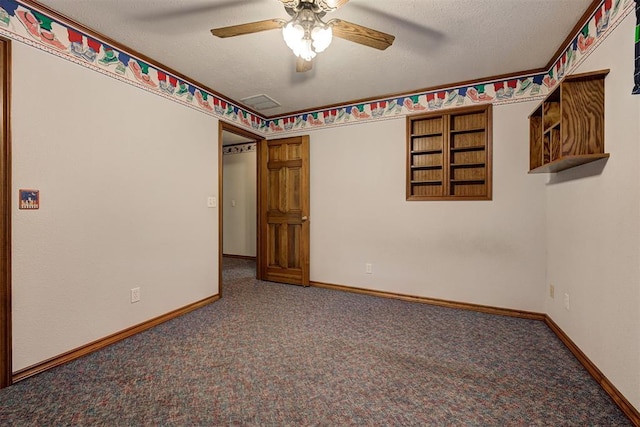 unfurnished bedroom featuring ceiling fan, carpet, and a textured ceiling