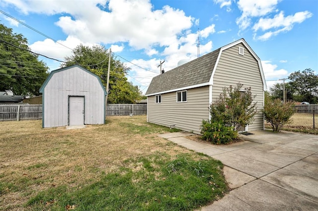 view of yard featuring a patio and a storage shed