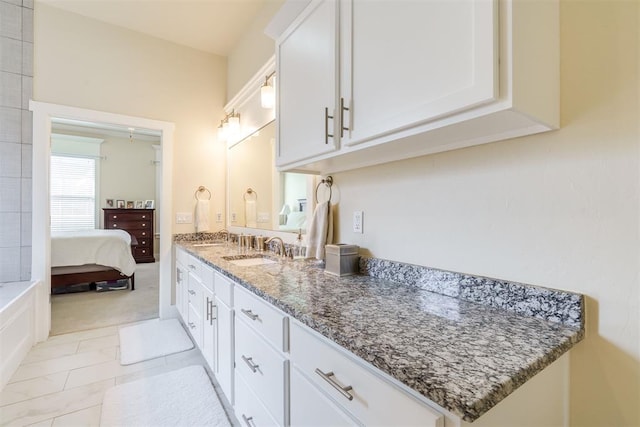 bathroom with tile patterned flooring and vanity