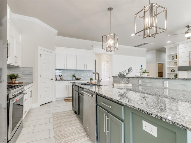 kitchen with white cabinets, pendant lighting, stainless steel appliances, green cabinets, and a sink