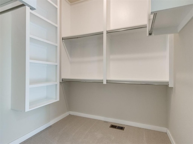 walk in closet with carpet floors and visible vents