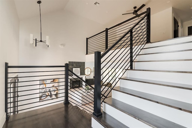 stairway with lofted ceiling