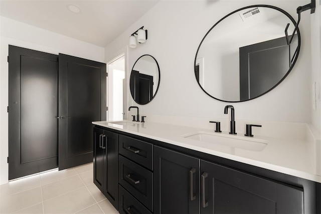 bathroom featuring tile patterned floors and vanity