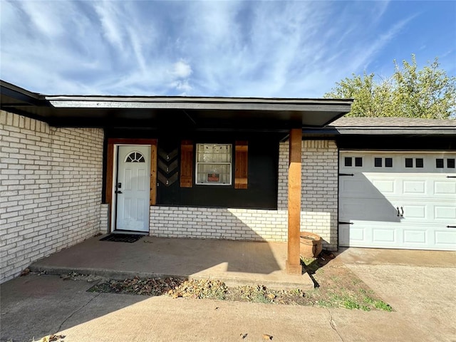 view of exterior entry featuring a garage