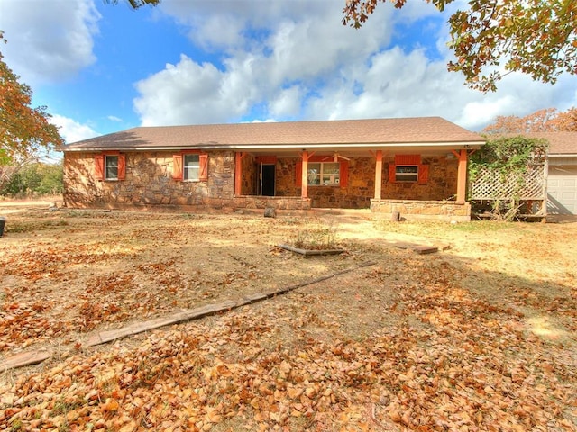 single story home featuring covered porch and ceiling fan