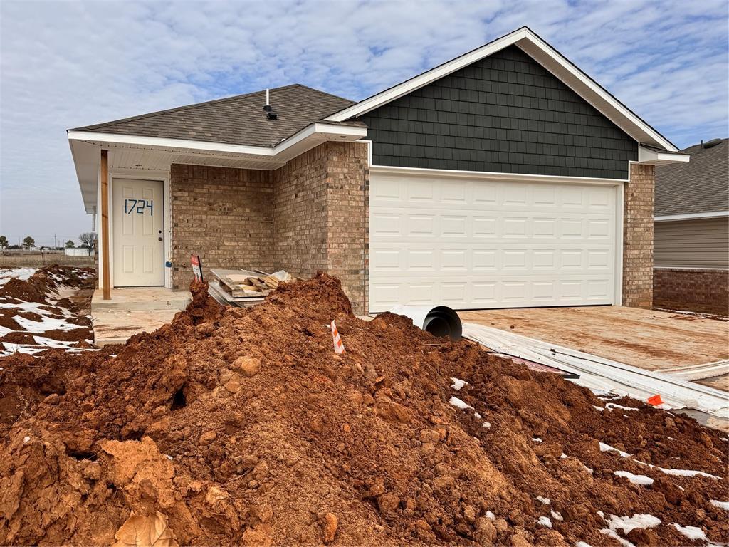 view of front of property with a garage