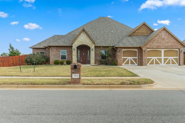 view of front of house featuring a front yard and a garage