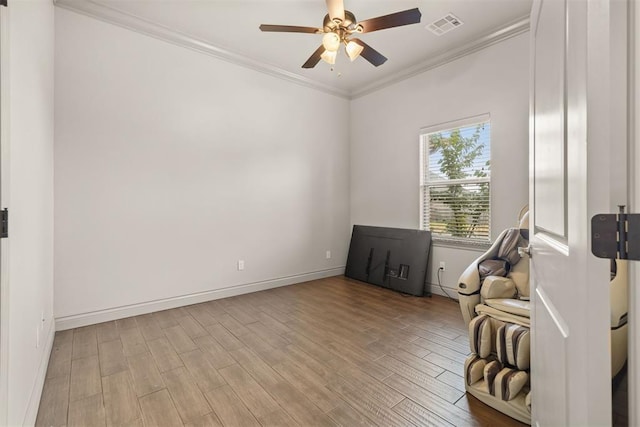 sitting room with ceiling fan, light hardwood / wood-style flooring, and ornamental molding