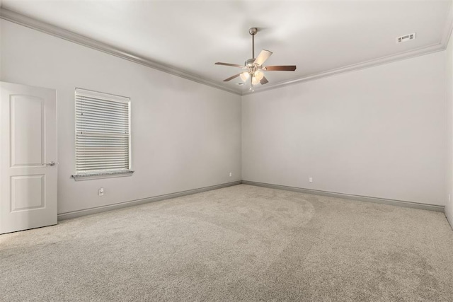 unfurnished room with light colored carpet, ceiling fan, and ornamental molding