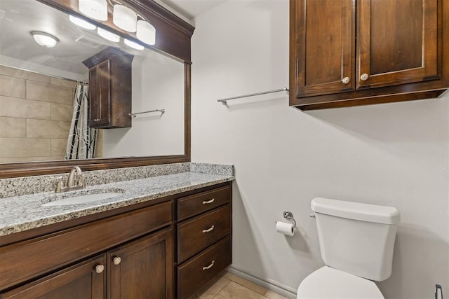 bathroom featuring tile patterned flooring, vanity, a shower with shower curtain, and toilet