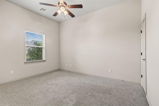 spare room with carpet floors and ceiling fan