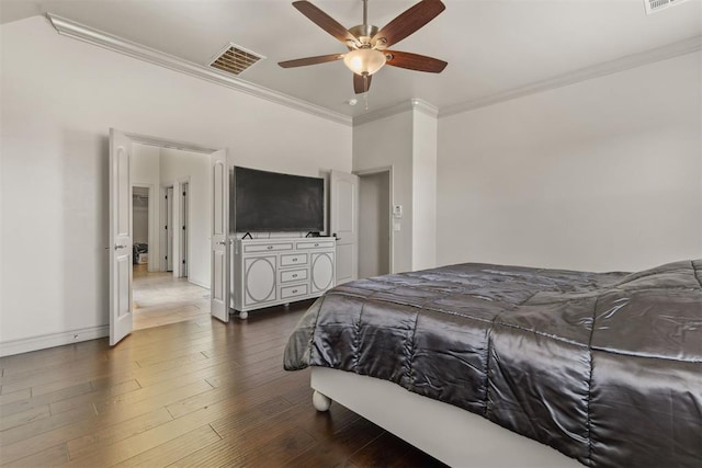 bedroom featuring ceiling fan, dark hardwood / wood-style floors, and ornamental molding