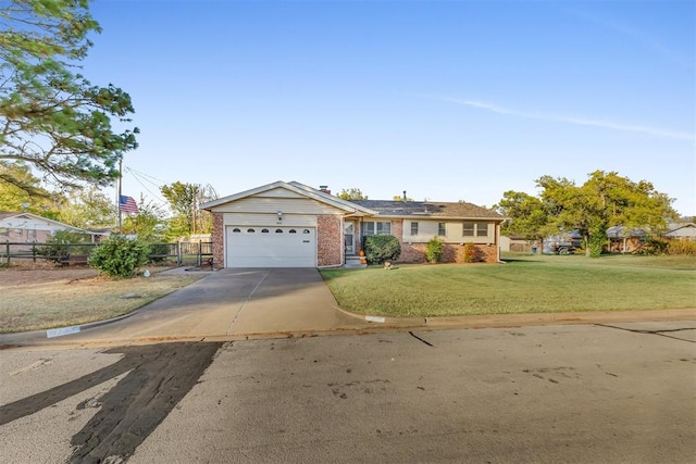 view of front facade with a garage and a front lawn