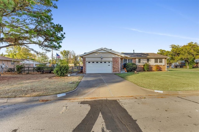 view of front facade featuring a front yard and a garage