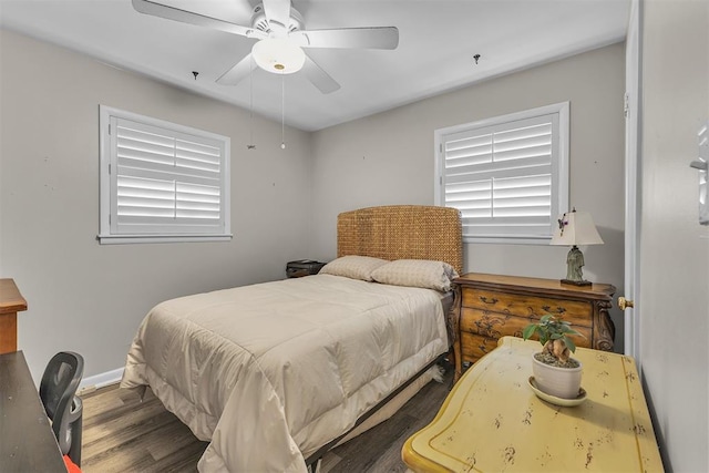 bedroom featuring ceiling fan and dark wood-type flooring