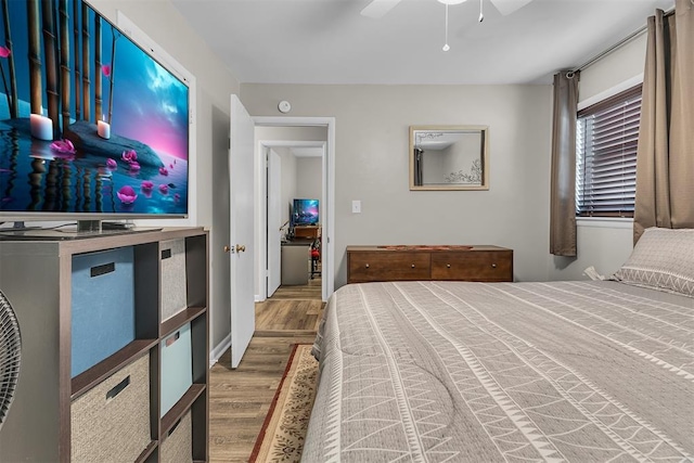 bedroom featuring hardwood / wood-style flooring and ceiling fan