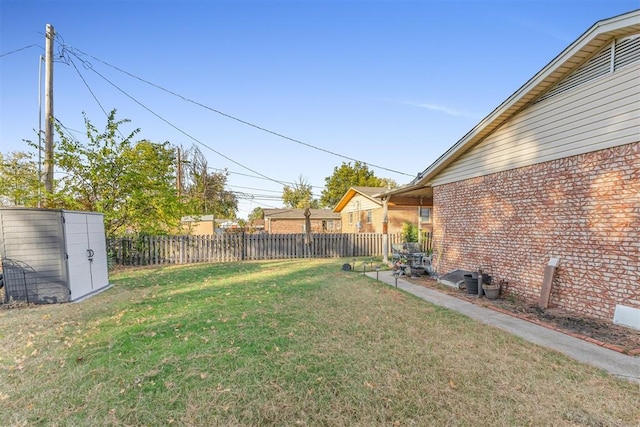 view of yard with a storage shed