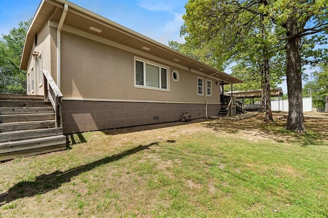 back of house with a yard