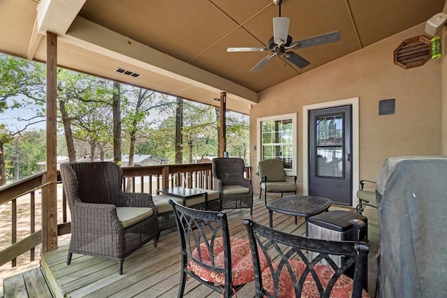 sunroom / solarium featuring ceiling fan and a healthy amount of sunlight