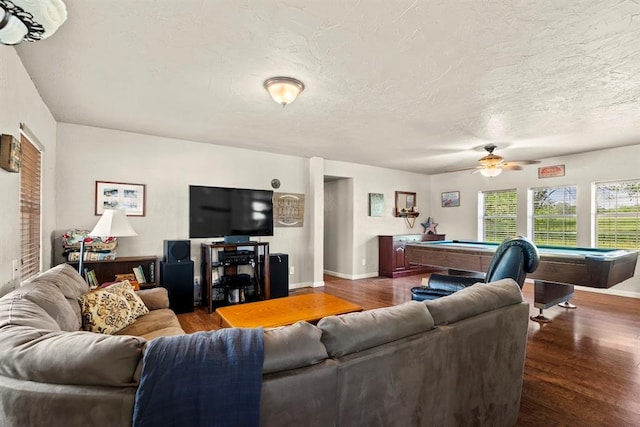 living room featuring a textured ceiling, ceiling fan, dark wood-type flooring, and billiards