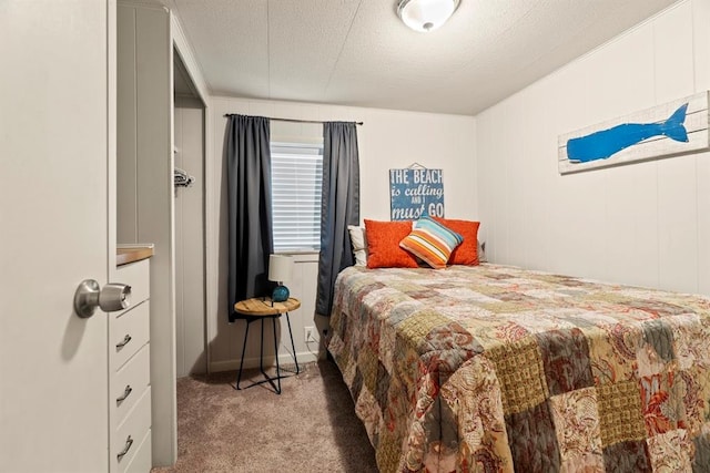 carpeted bedroom featuring a textured ceiling