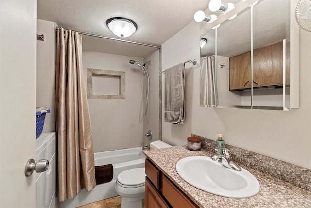 full bathroom with shower / bath combo, tile patterned flooring, a textured ceiling, toilet, and vanity