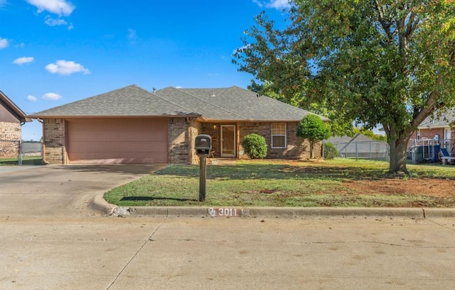 ranch-style house with a front lawn and a garage