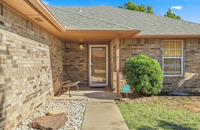 entrance to property with a patio area