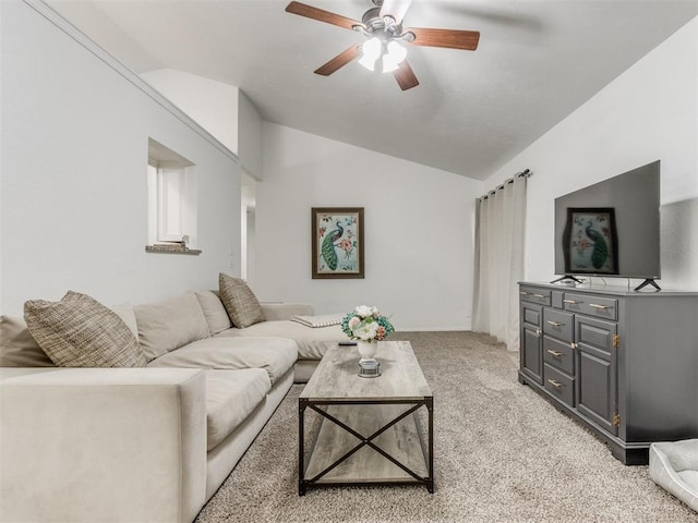 living room featuring ceiling fan, light carpet, and vaulted ceiling