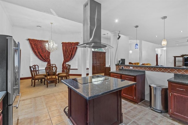 kitchen featuring pendant lighting, a center island, black electric stovetop, stainless steel fridge, and island range hood