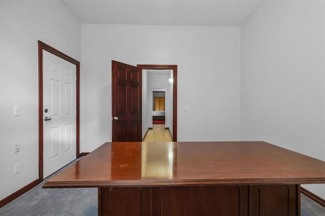 unfurnished office featuring light colored carpet