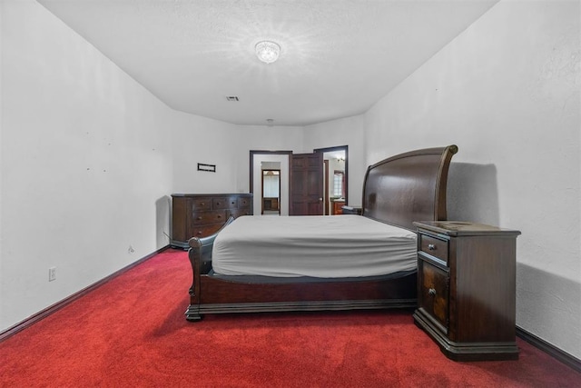 bedroom featuring dark carpet