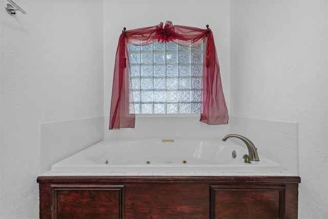 bathroom with a washtub