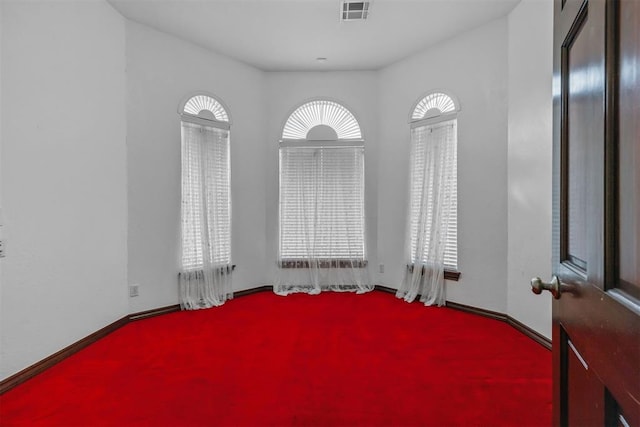 unfurnished room with light carpet