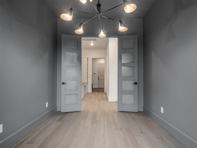 spare room featuring light hardwood / wood-style flooring