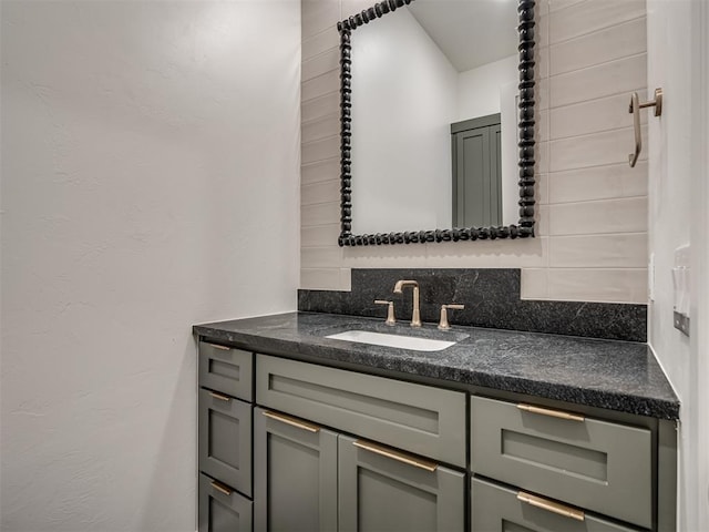 bathroom featuring tasteful backsplash and vanity